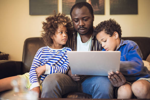 istock Father teaching his kids at home 1264046405