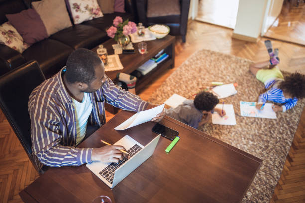 istock Father teaching his kids at home 1264046461