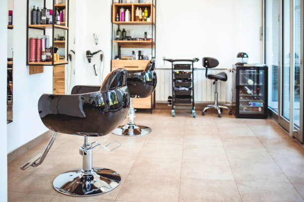istock Horizontal shot of empty chairs in retro styled barbershop. 1264049329