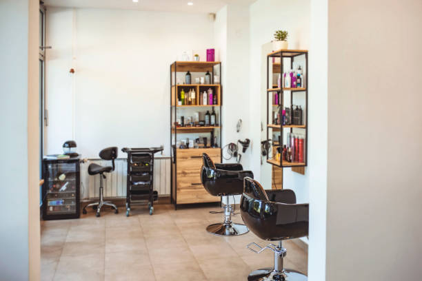 istock Horizontal shot of empty chairs in retro styled barbershop. 1264049335
