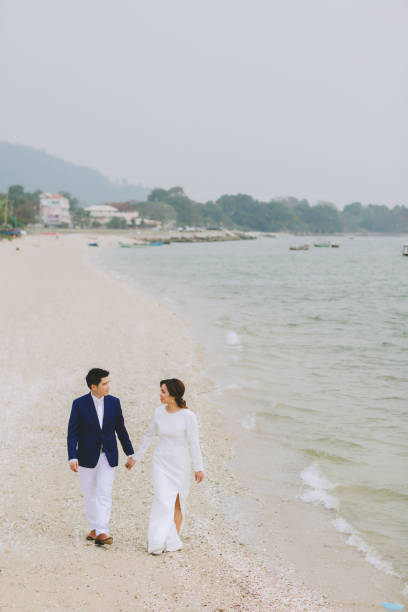 istock Young asian groom and bride posing and smiling for pre-wedding shot 1264054920