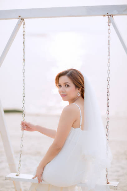 istock Young asian groom and bride posing and smiling for pre-wedding shot 1264054979