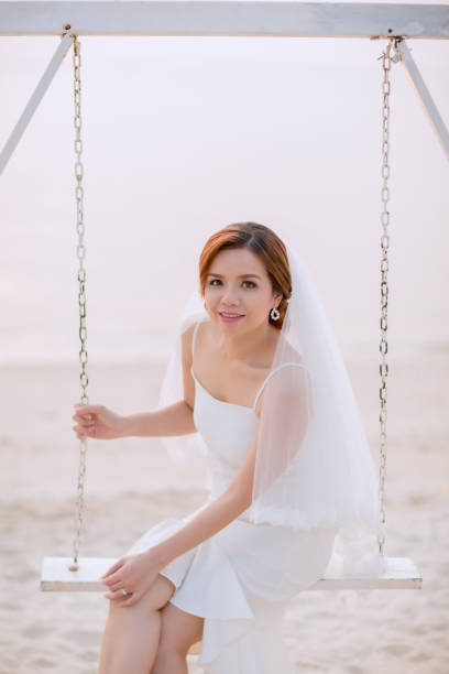 istock Young asian groom and bride posing and smiling for pre-wedding shot 1264054999