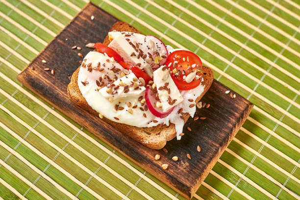 istock Toast with egg, tomatoes, vegetables and spices. 1264055463