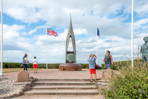 Ouistreham, France. Monday 27 July 2020. People looking at the WWII memorial in Ouistreham, France