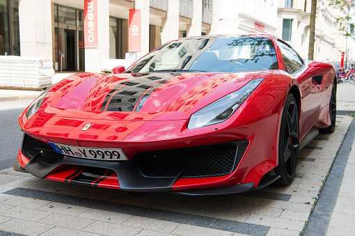 Hamburg, Germany-July 27, 2019: Supercar red Ferrari 488 Pista parked at the street in Hamburg, Germany . Lamborghini is famous expensive automobile brand car