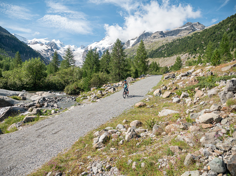 Woman on mountain bike passing on flow trail