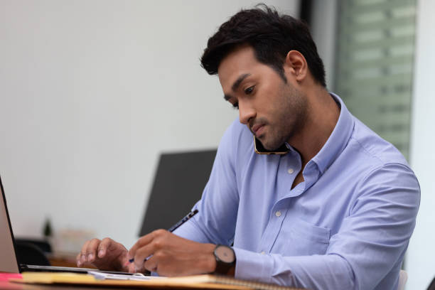 istock Business man working and note job in paper in office. 1264064763