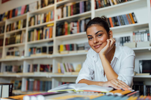 istock Relaxing time. Girl reading something in a library. 1264067953