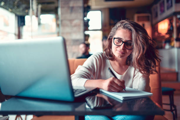 istock Female Journalist Starting Her Work In Coffee Bar 1264068612