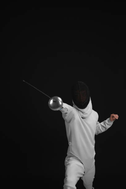 istock Man holding fencing foil 1264069350