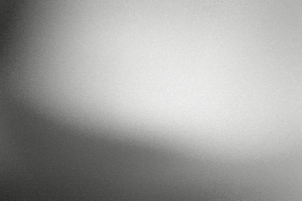 istock Glowing black silver foil metal wall with copy space, abstract texture background 1264070051