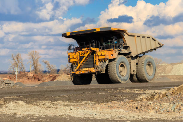 istock Huge yellow mining dump truck working in iron ore quarry. Mining industry 1264074775