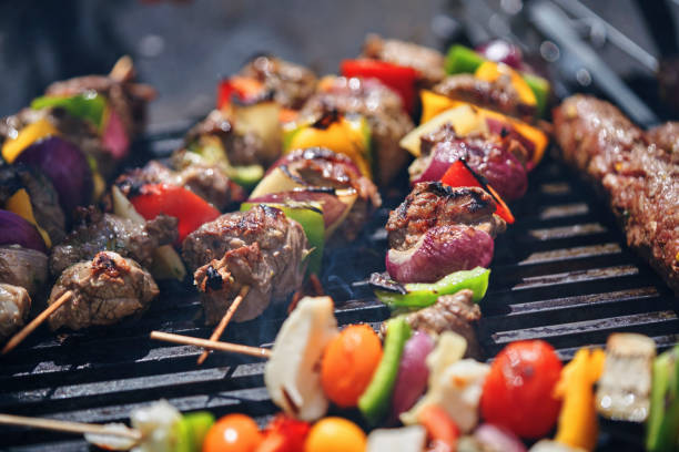 Grilled skewers on a grilled plate, top view, outdoor