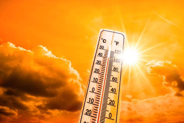 Heatwave Hot summer or heat wave background, glowing sun on orange sky with thermometer heat wave photos stock pictures, royalty-free photos & images