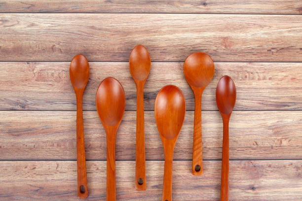 istock a wooden spoon on a vintage tree background 1264078711