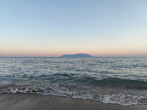 The island of Samothrace in Northern Aegean sea in Greece as seen from the sores of Alexandroupoli at dusk