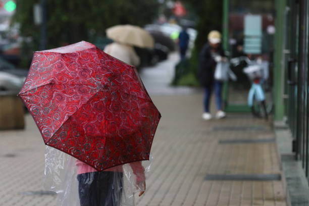 istock Little girl with an umbrella 1264079701