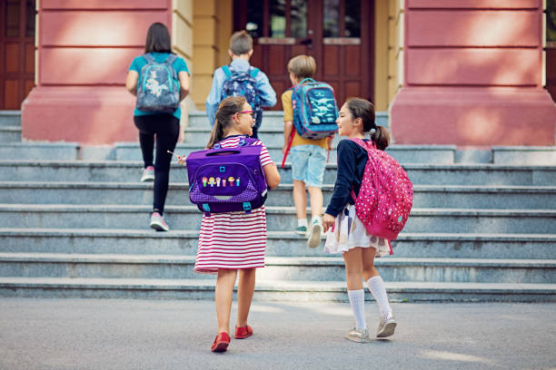 School children are entering the school