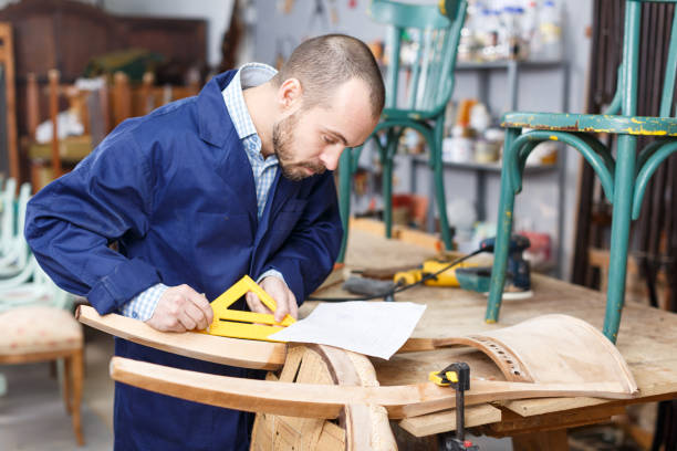 istock Carpenter repairing antique chair 1264081563