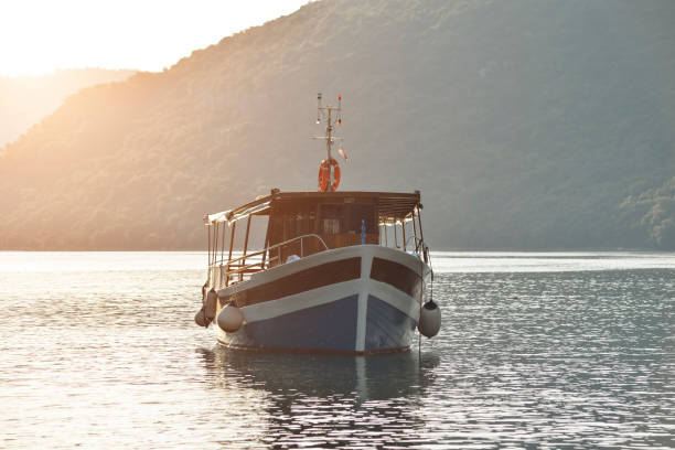 Limski Kanal Limski Fjord in Istria near Rovinj. Adriatic Sea, Croatia. Limski Fjord and little boat. Rovinj, Croatia - May 22, 2020: Limski Kanal Limski Fjord in Istria near Rovinj. Adriatic Sea, Croatia. Limski Fjord and little boat. kanal stock pictures, royalty-free photos & images