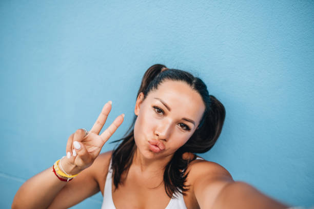 istock Portrait of model plus size at blue wall 1264084899
