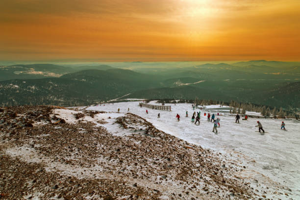 Ski slope on sunset in ski resort Sheregesh, Siberia, Russia. Misty mountain peaks. Mountain landscape. Ski slope on sunset in ski resort Sheregesh, Siberia, Russia. Misty mountain peaks. Mountain landscape. Sheregesh stock pictures, royalty-free photos & images