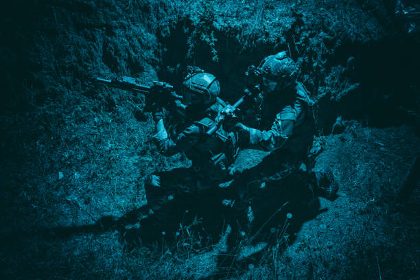 istock US Navy SEALs team shooters moving in trench 1264085225