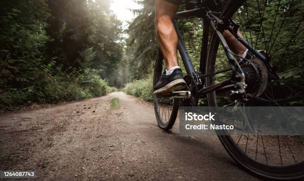 Close Up Of A Biker On A Bike Stock Photo - Download Image Now - Cycling, Bicycle, Footpath