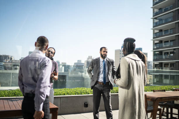 istock Business people talking on terrace office rooftop 1264088006