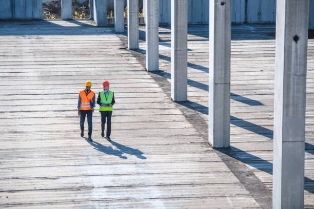 istock Construction Foreman and Manager Walking Length of Site 1264090424