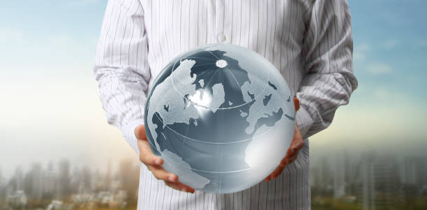 istock Glass globe in hand, Energy saving concept, Elements of image furnished by NASA 1264090436