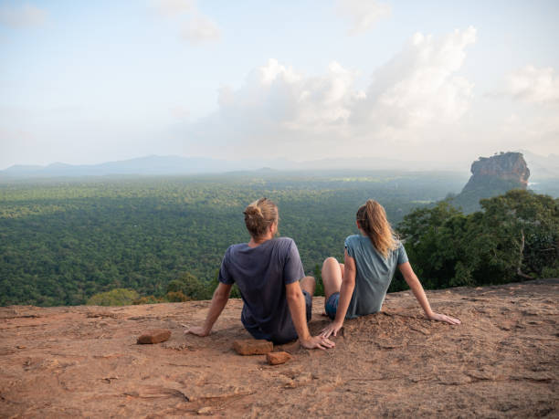 istock Couple contemplating famous Sigiriya rock at sunset 1264092257