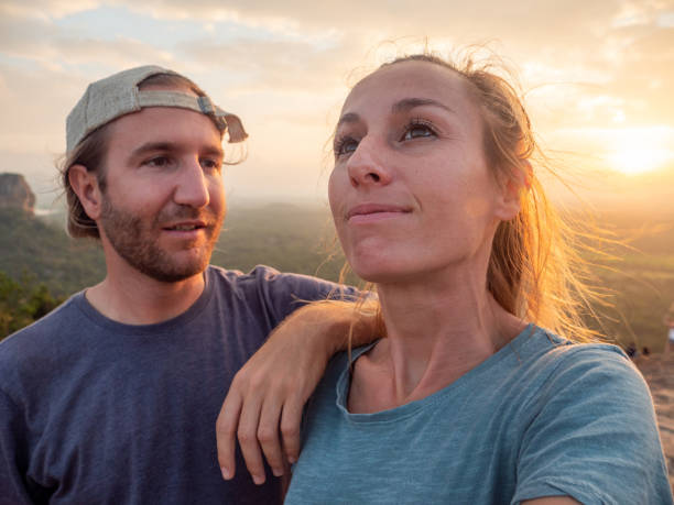 istock Couple contemplating famous Sigiriya rock at sunset 1264092321