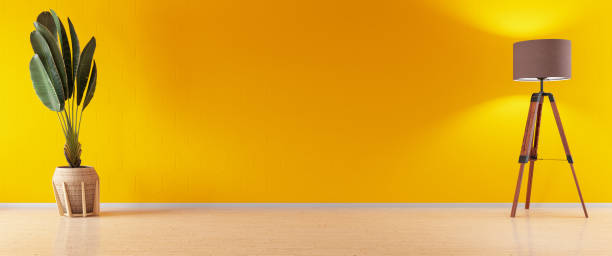 istock Empty Yellow Wall with Floor Lamp and Plant 1264093785