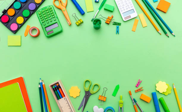 istock School supplies on green color background, top view, copy space 1264095083