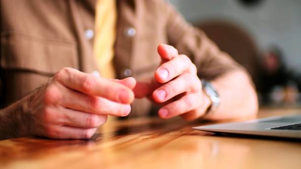istock the gestures of a man next to a laptop 1264095596