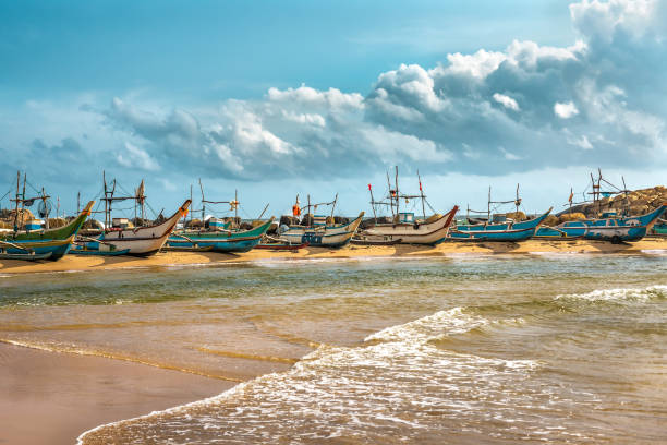 row of fishing boat on Sri Lanka row of colorful fishing boat on Sri Lanka southern sri lanka stock pictures, royalty-free photos & images