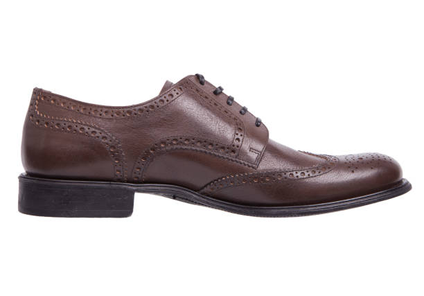 istock Men's classic brown leather shoes isolated on white background. 1264095924