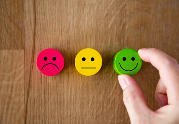istock Customer service evaluation and satisfaction survey concepts. The client hand picked the happy face smile icon. 1264097150