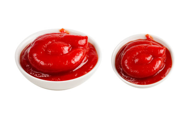 istock Ketchup in white plate on white background. 1264100228