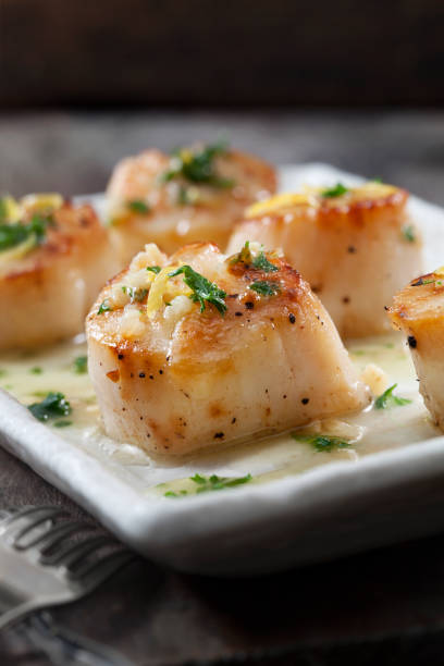 istock Scallops Poached in a Butter and Garlic Sauce 1264102644