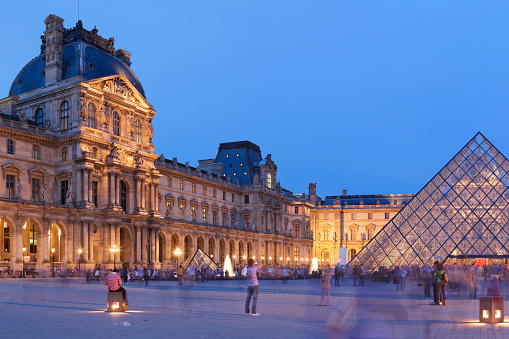 France, Paris - May 6, 2011: Night time view of the Louvre Museum and the I. M. Pei designed Louvre pyramid.
