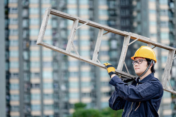 istock Maintenance worker man carrying aluminium ladder 1264103130