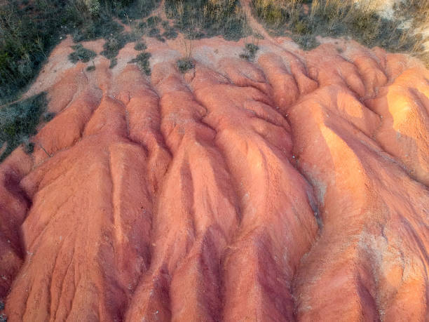 istock Bauxite mine, raw weathered bauxite sedimentary rock on surface 1264103188