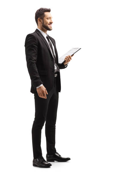 uomo elegante con un abito nero con in mano gli appunti - people formalwear vertical full length foto e immagini stock