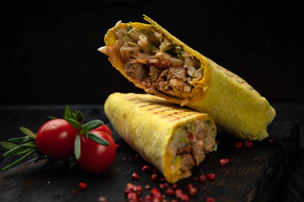 istock Delicious shawarma on a wooden board 1264108806