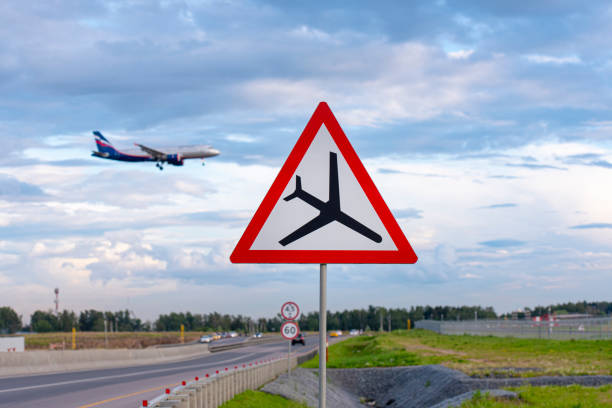 istock Road airplane traffic sign, attention sign with plane 1264108895