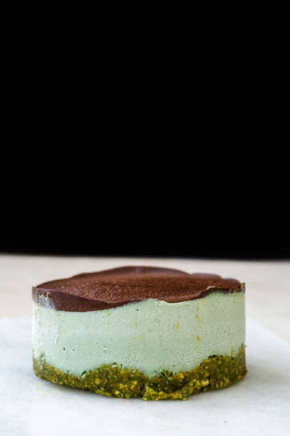 istock Vegan Raw Round Cheesecake with Mint, Bitter Chocolate and Pistachio Nut Paste. 1264109063