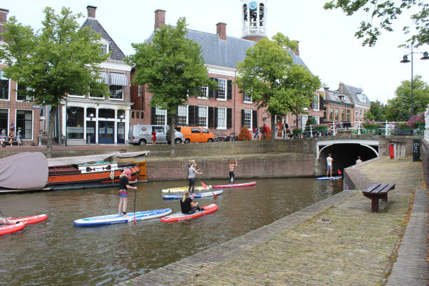 Tourists usings SUPS in Dokkum, Friesland stock photo